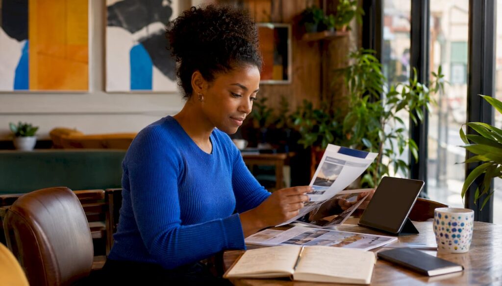 Woman researching salon booking software alternatives