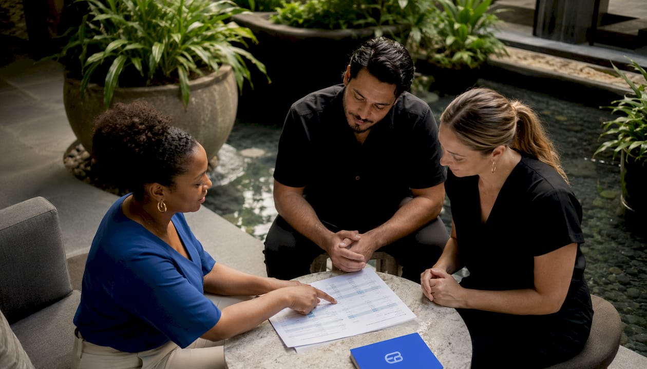 Spa staff discussing bookings at reception