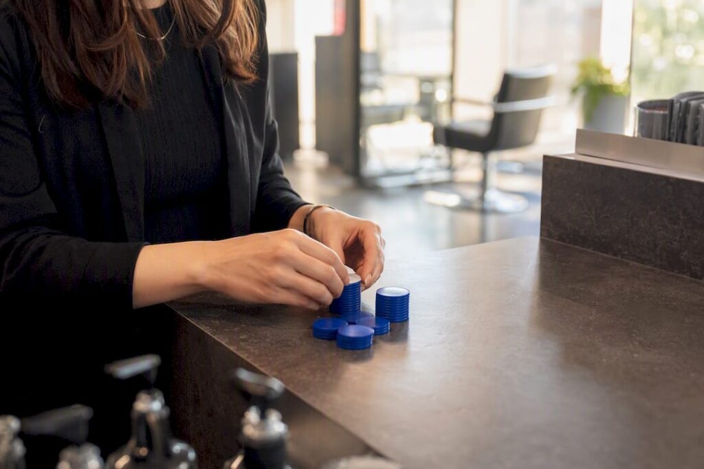 Hands counting booking deposit tokens